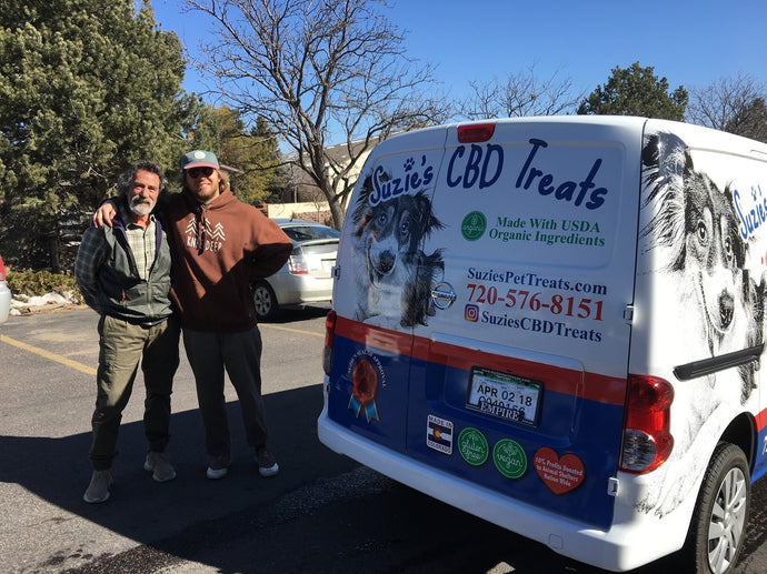 Caleb and Richard posing with their first delivery van, wrapped in Suzie's brand marketing.